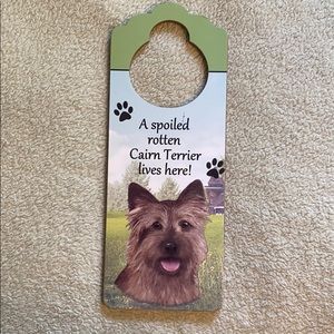 Door hanger- “A spoiled rotten Cairn Terrier...”